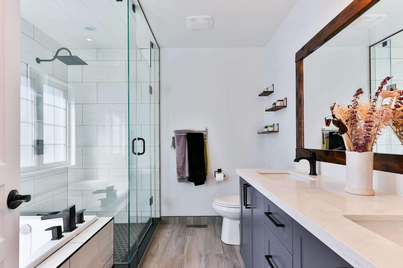 Modern walk-in shower with glass enclosure for accessible bathing